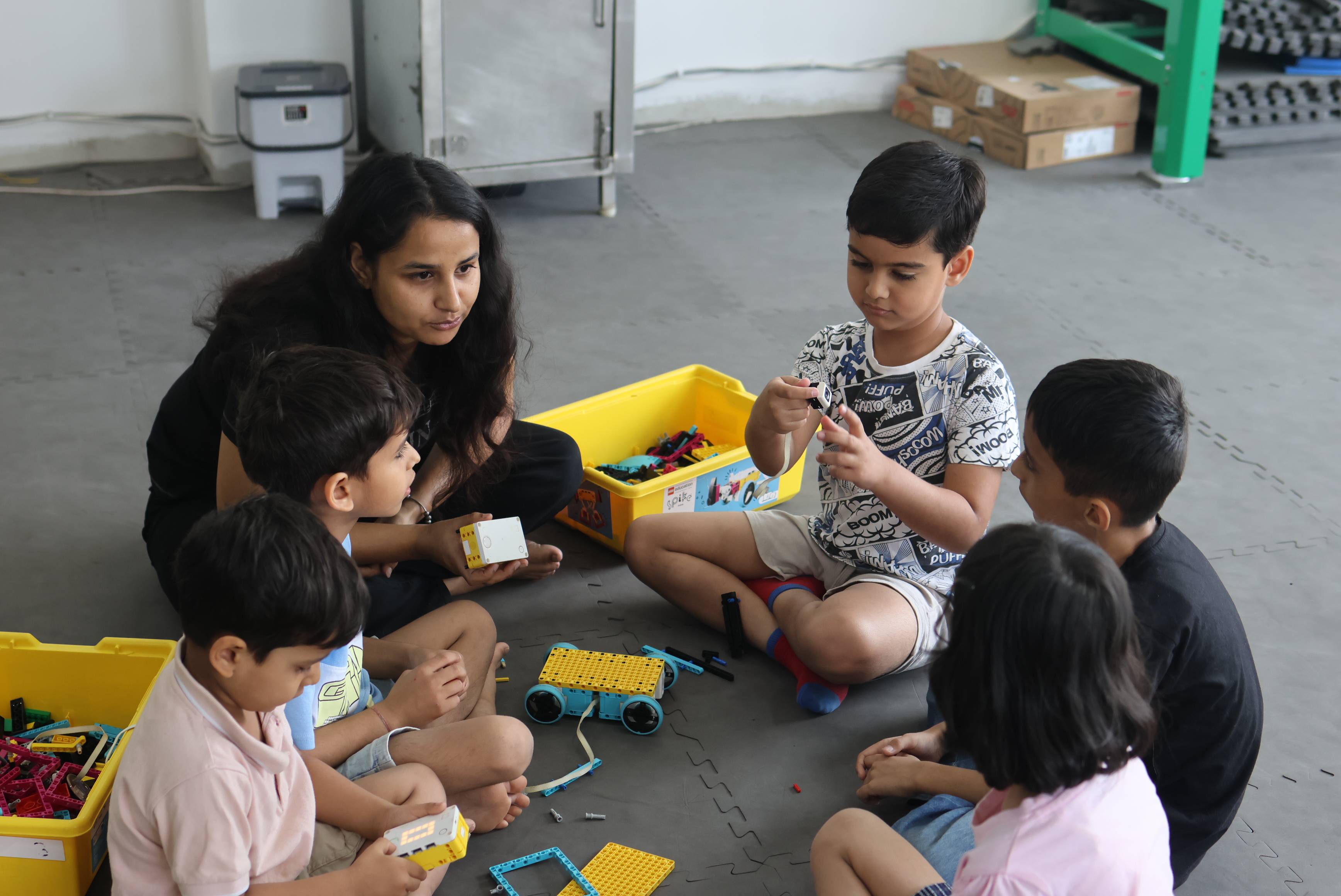Children of different ages working on robotics projects at MittyVerse Gurugram